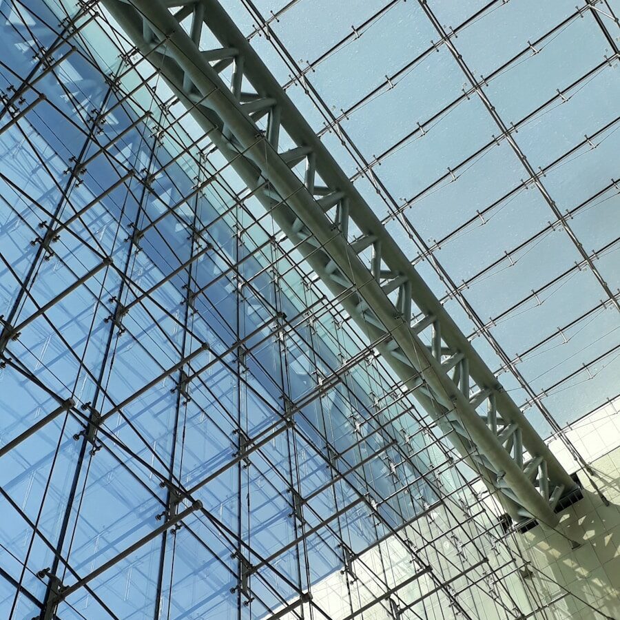 a close up of a glass and steel structure