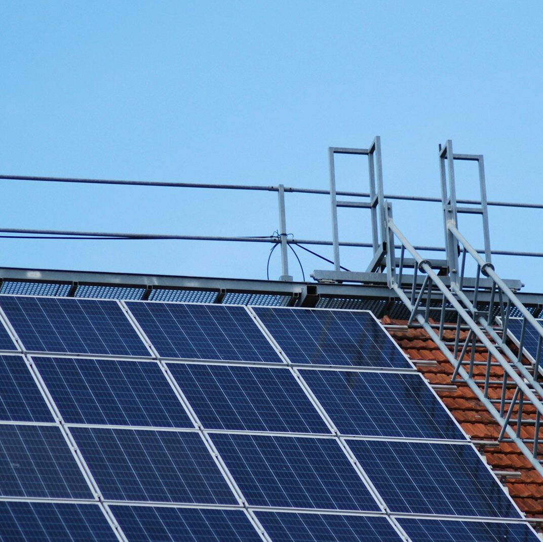 solar panels on gray metal frame under blue sky during daytime